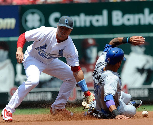 Ian Desmond of the Rangers steals second as Cardinals shortstop Aledmys Diaz cannot come up with the throw during the first inning of Sunday afternoon's game at Busch Stadium.