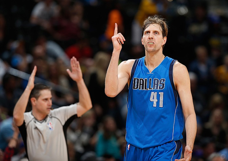 Dallas Mavericks forward Dirk Nowitzki, of Germany, reacts after hitting a three-point basket against the Denver Nuggets in overtime of an NBA basketball game Sunday, March 6, 2016, in Denver. The Nuggets won 116-114 in overtime. 