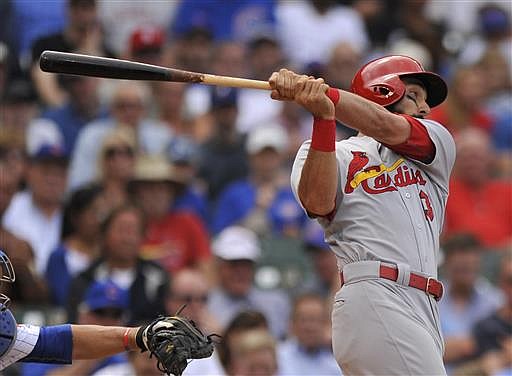 St. Louis Cardinals' Matt Carpenter watches his two-run double during the sixth inning of a baseball game against the Chicago Cubs, Wednesday, June 22, 2016, in Chicago. 