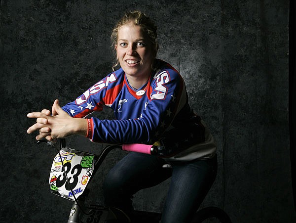 In this April 16, 2008, file photo, BMX cyclist Jill Kintner poses for a portrait during the USOC Media Summit in Chicago. Kintner is one of the world's best downhill mountain bikers, hurtling herself down rock-strewn trails at breakneck speeds in an Adrenaline-pounding version of the sport. 