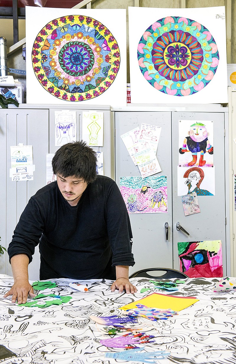 Norris Burns works on a mandala on June 2, 2016, at the ArtMakers' Place in Kansas City, Kan. The Wyandot Center uses the art studio and gallery as part of its treatment for adults living with mental illness.