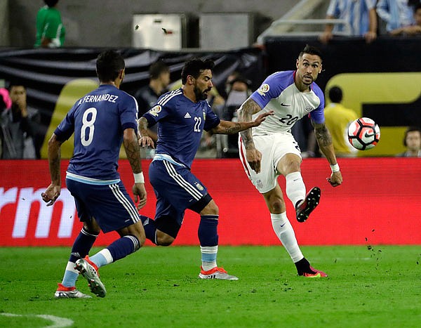 Argentina's Nicolas Otamendi and Clint Dempsey of the United States battle during Tuesday night's Copa America semifinal in Houston.