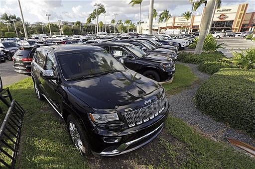 In this Thursday, Nov. 5, 2015, file photo, 2015 Grand Cherokees appear on display at a Fiat Chrysler dealership in Doral, Fla. Fiat Chrysler is speeding up a recall of 1.1 million vehicles with confusing gear shifters like one in the SUV that crushed and killed Star Trek actor Anton Yelchin, the company announced Wednesday, June 22, 2016. Yelchin, 27, known for playing Chekov in the rebooted series, died Sunday, June 19, after his 2015 Jeep Grand Cherokee pinned him against a mailbox pillar and security fence at his home in Los Angeles.