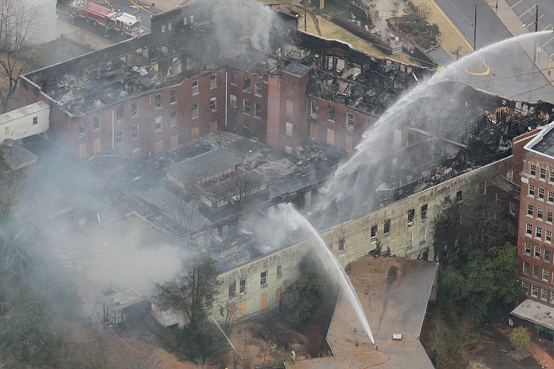  Hot Springs Fire Department firefighters battle a blaze at the vacant Majestic Hotel  on February 27, 2014, in Hot Springs, Ark.