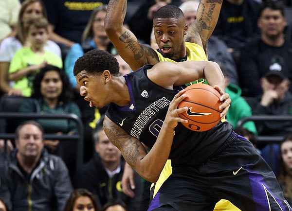 In this Feb. 28, file photo, Washington forward Marquese Chriss battles Elgin Cook of Oregon for position under the basket during a game in Eugene, Ore.