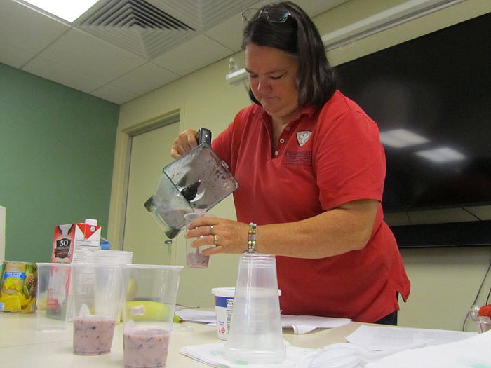 Mylene Dunn pours a smoothie.