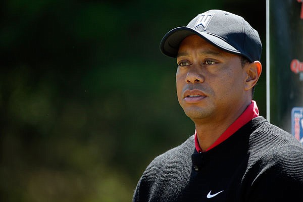 Tiger Woods pauses during a Quicken Loans National media availability May 26 on the 10th tee at Congressional Country Club in Bethesda, Md.