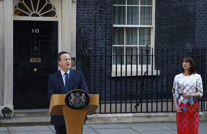 Britain's Prime Minister David Cameron, accompanied by his wife, Samantha, speaks to the media in front of 10 Downing street, London, on Friday, June, 24, 2016, as he announces he will resign by the time of the Conservative Party conference in the autumn, following the result of the EU referendum, in which the Britain voted to leave the EU.