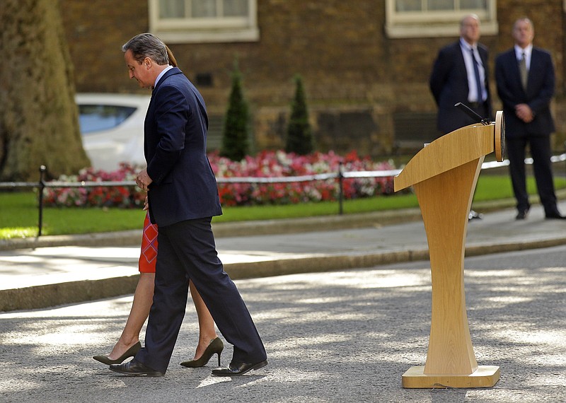 In this Friday, June 24, 2016, file photo, Britain's Prime Minister David Cameron and his wife Samantha walk back into 10 Downing Street, London, after speaking to the media. Cameron says he will resign by the time of the party conference in the fall after Britain voted to leave the European Union after a bitterly divisive referendum campaign, according to tallies of official results Friday.
