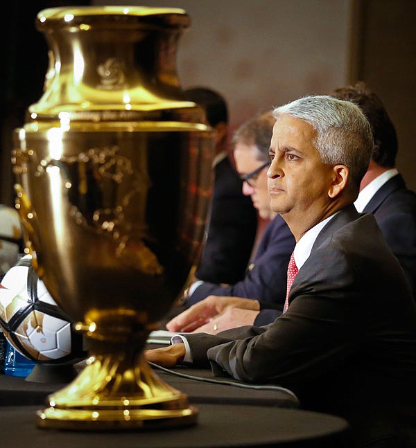 Sunil Gulati, president of U.S. Soccer sits next to the championship trophy for the Copa America Centenario during a news conference Friday in New York.