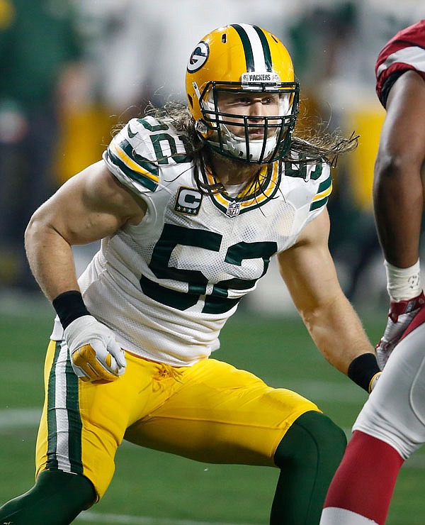In this Jan. 16, file photo, Packers inside linebacker Clay Matthews chases a play during an NFL divisional playoff game against the Cardinals in Glendale, Ariz. Matthews, Julius Peppers and James Harrison will be interviewed next month by NFL officials in connection to a media report that linked them to the use of performance-enhancing drugs.