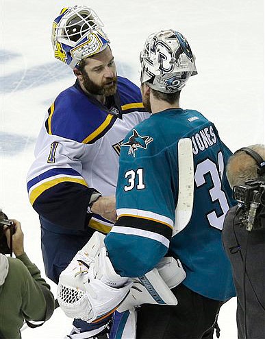 In this May 23, 2016 file photo, St. Louis Blues goalie Brian Elliott, left, greets San Jose Sharks goalie Martin Jones (31) after the Sharks beat the Blues in Game 6 of the NHL hockey Stanley Cup Western Conference finals in San Jose, Calif.