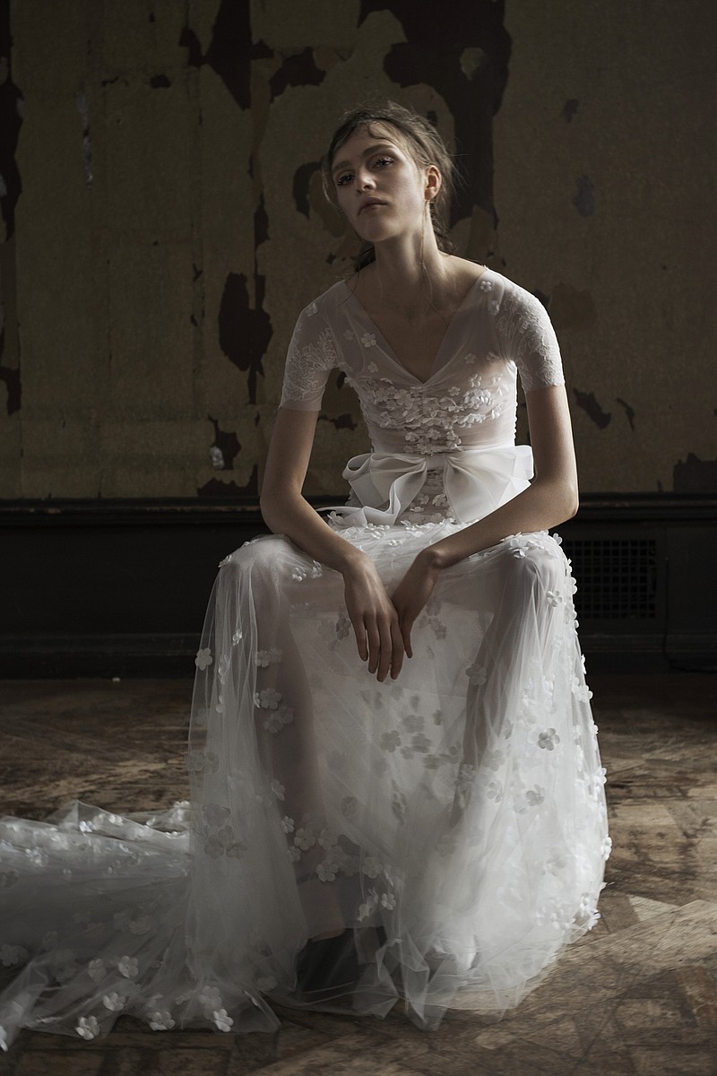 This photo provided by Vera Wang shows a Spring 2016 bridal gown. "It's more about the body now," said Wang, whose spring 2016 bridal lookbook is filled with sexy sheers that show all. "What we're trying to do more is really capture a certain sense of intimacy in body language."