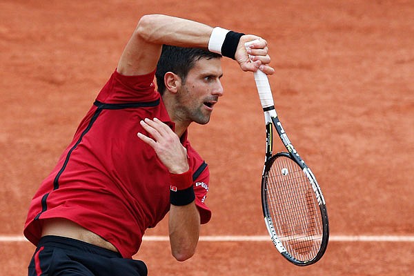 In this June 5, file photo, Novak Djokovic serves the ball in the final of the French Open against Andy Murray at the Roland Garros stadium in Paris.