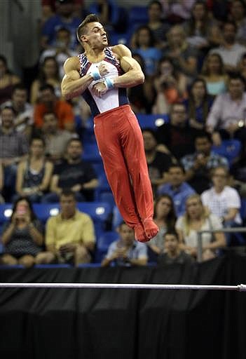 Sam Mikulak competes on the high bar during the U.S. men's Olympic gymnastics trials Saturday, June 25, 2016, in St. Louis.