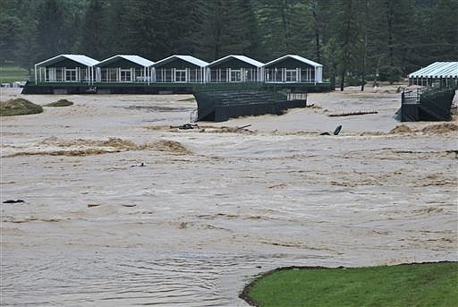This Thursday June 23, 2016 image provided by the Greenbrier shows flooding on the 17th green of the Old White Course at the Greenbrier in White Sulphur Springs, W. Va. Severe flooding hit the area that is scheduled to host a PGA tour event in two weeks. 