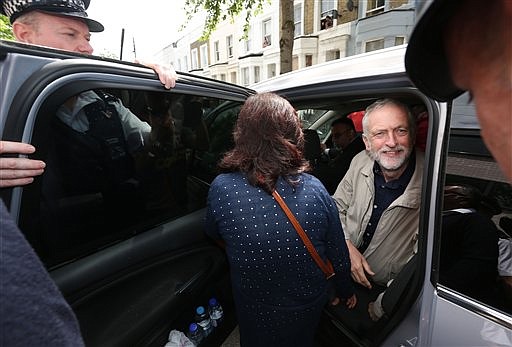 Labour leader Jeremy Corbyn leaves his house in London, Sunday June 26, 2016.  Corbyn seems to be facing a revolt by some members of his shadow cabinet, as a string of shadow ministers quit Sunday in protest at his leadership during the EU referendum campaign. 
