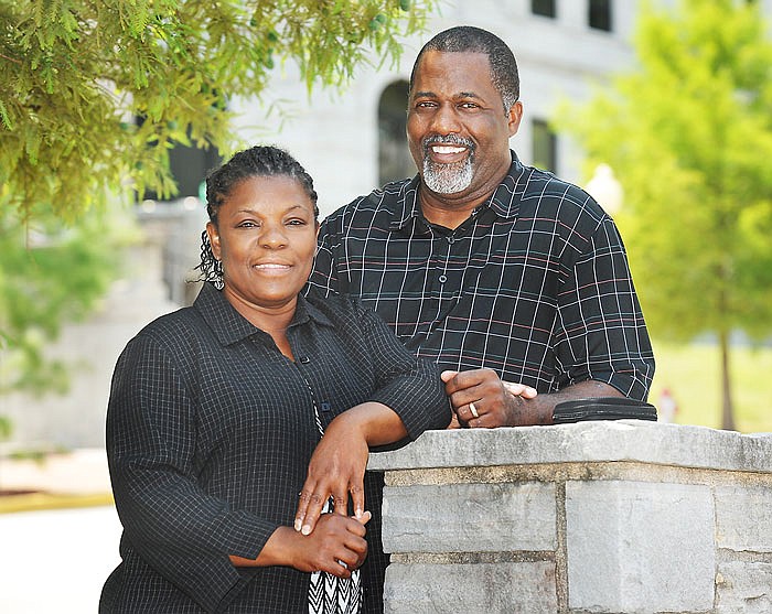 Cynthia and Curtis Scroggins pose for a photograph outside of the News Tribune. The couple recently became mentors in the Capital City Court Appointed Special Advocates (CASA). 