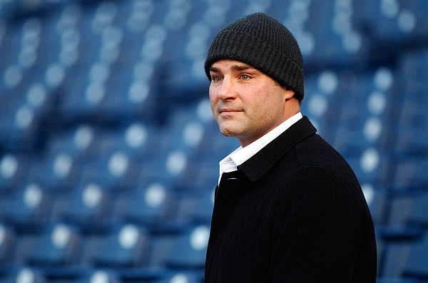 In this Dec. 30, 2011, file photo, former Philadelphia Flyers player Eric Lindros looks out from the stands at Citizens Bank Park where preparations are underway for NHL's Winter Classic in Philadelphia.