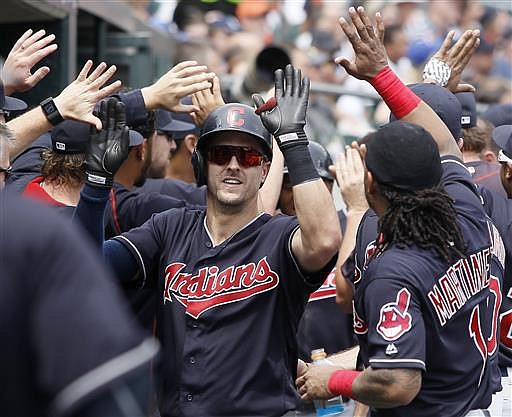 Cleveland Indians' Lonnie Chisenhall, left, celebrates with Michael Martinez (1) after hitting a two-run home run against the Detroit Tigers during the fifth inning of a baseball game Sunday, June 26, 2016, in Detroit. The Indians defeated the Tigers 9-3.