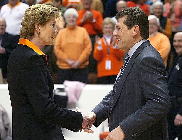 In this 2006 file photo, Tennessee coach Pat Summitt (left) shakes hand with Connecticut coach Geno Auriemma before a game in Knoxville, Tenn. The update on Summitt's health caught Auriemma by surprise.