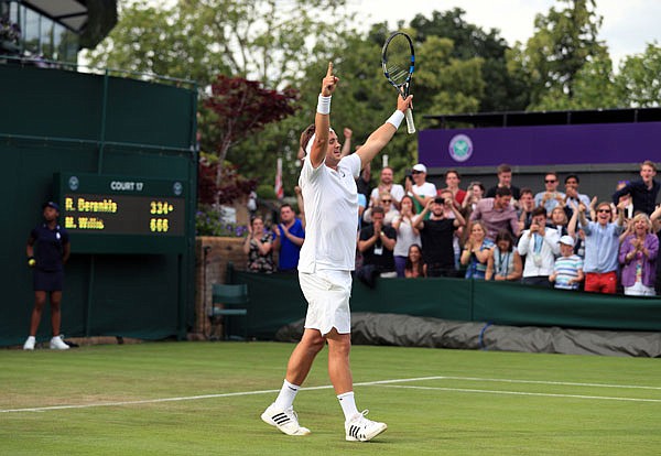 Marcus Willis, ranked No. 772, celebrates his victory Monday over Ricardas Berankis 6-3, 6-3, 6-4 on the opening day of Wimbledon in London.