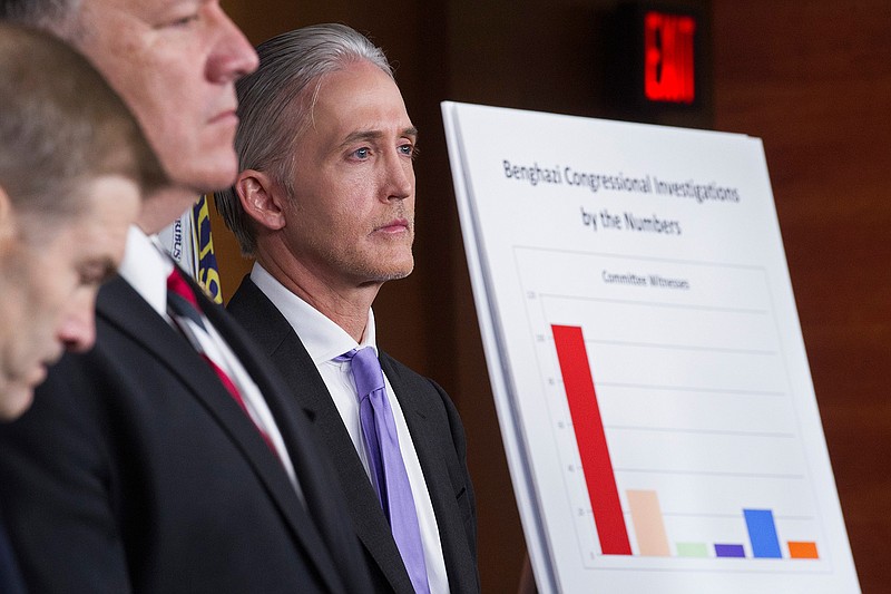 House Benghazi Committee Chairman Rep. Trey Gowdy, R-S.C., right, listens during a news conference on Capitol Hill in Washington, Tuesday, June 28, 2016, to discuss the release of his final report on the 2012 attacks on the U.S. consulate in Benghazi, Libya, where a violent mob killed four Americans, including Ambassador Christopher Stevens. 