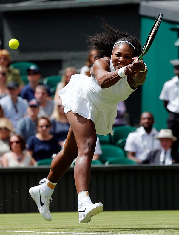 Serena Williams plays a return to Amara Safikovic during Tuesday's women's singles match on Day 2 of the Wimbledon Championships in London.