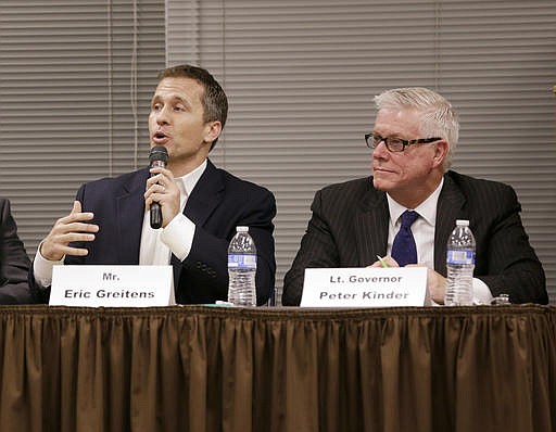 In this Nov. 3, 2015, file photo, Missouri Republican gubernatorial candidates, former Navy SEAL Eric Greitens, left, and Lt. Gov. Peter Kinder participate in a forum in Jefferson City, Mo. 