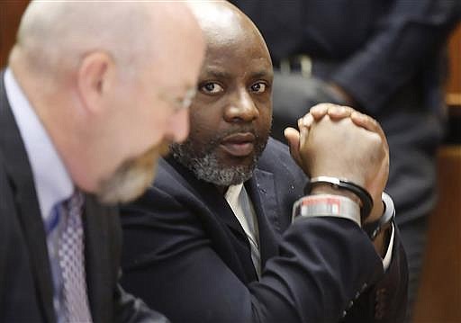 Defendant Shawn Custis, right, sits in court with his attorney John McMahon before he was sentenced to life plus 5 years by Superior Court Judge Ronald Wigler Wednesday, June 29, 2016, in Newark, N.J. Earlier Custis was found guilty in the brutal beating of a woman during a 2013 home invasion caught on a nanny-cam home security video. (Robert Sciarrino/NJ Advance Media via AP, Pool)
