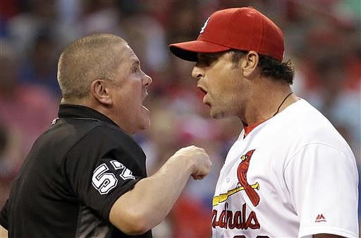 St. Louis Cardinals manager Mike Matheny, right, argues with home plate umpire Mike Everitt after being ejected during the sixth inning of the team's baseball game against the Kansas City Royals on Thursday, June 30, 2016, in St. Louis.