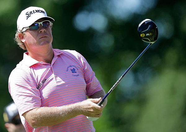 William McGirt tees off on the third hole during the first round Thursday of the Bridgestone Invitational at Firestone Country Club in Akron, Ohio. 