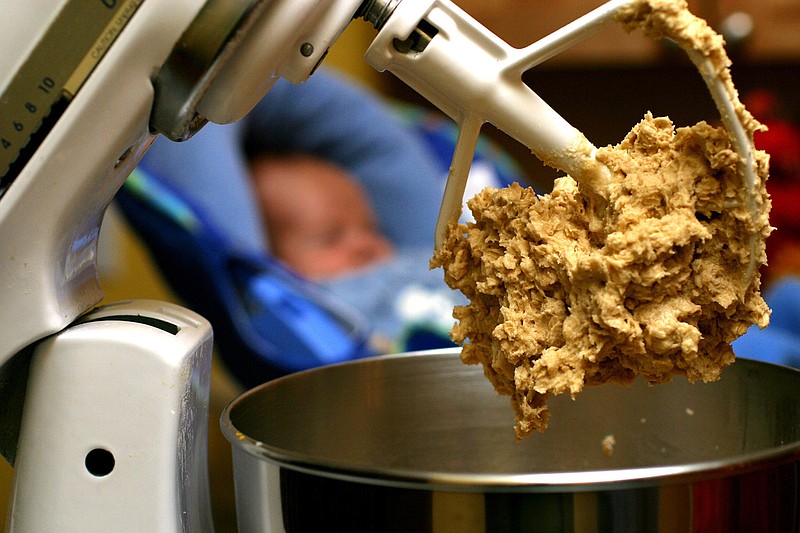 In this undated file photo, cookie dough clings to the beaters of a standing mixer. The Food and Drug Administration issued a warning on June 28, 2016, that people shouldn't eat raw dough due to an ongoing outbreak of illnesses related to a strain of E. coli bacteria found in some batches of flour.