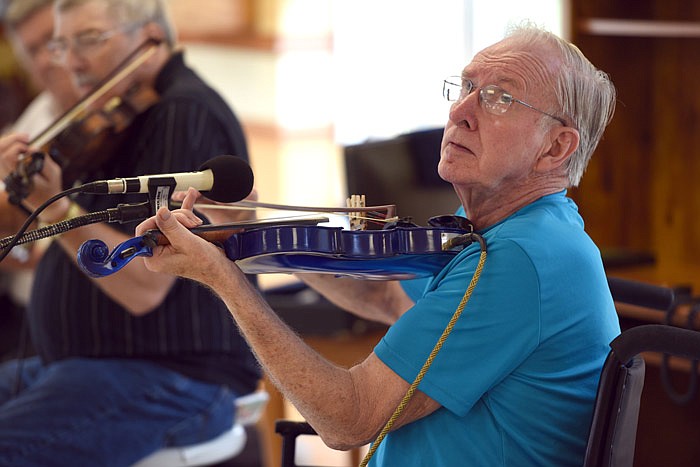 Leroy Haslag plays electric violin at the Golden LivingCenter. Haslag used to play at the Ozark Opry; he now occasionally plays bluegrass music at the center where he resides.