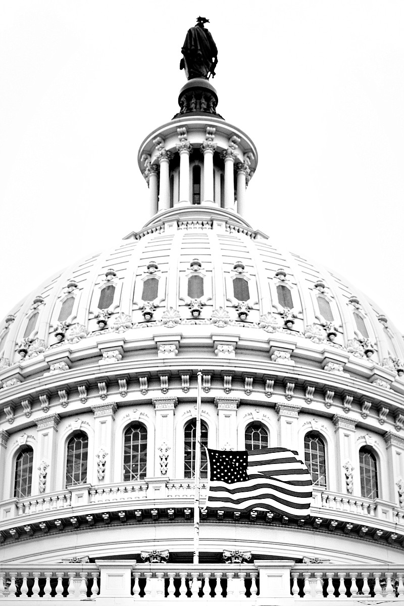 The American flag is seen at half-staff June 5, 2004, at the U.S. Capitol in Washington, a few hours after the announcement of the death of former President Ronald Reagan.