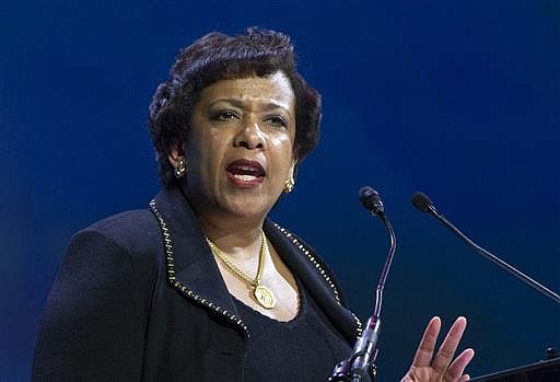  In this June 14, 2016 file photo, Attorney General Loretta Lynch speaks in Washington. Former President Bill Clinton spoke with Lynch during an impromptu meeting in Phoenix, but Lynch says the discussion did not involve the investigation into Hillary Clinton's email use as secretary of state. 
