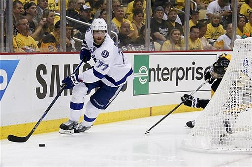 In this May 26, 2016, file photo, Tampa Bay Lightning's Victor Hedman (77) moves the puck against the Pittsburgh Penguins during the second period of Game 7 of the NHL hockey Stanley Cup Eastern Conference finals in Pittsburgh. The Lightning have signed Hedman to a $63 million, eight-year contract extension on Friday, July 1, 2016. 