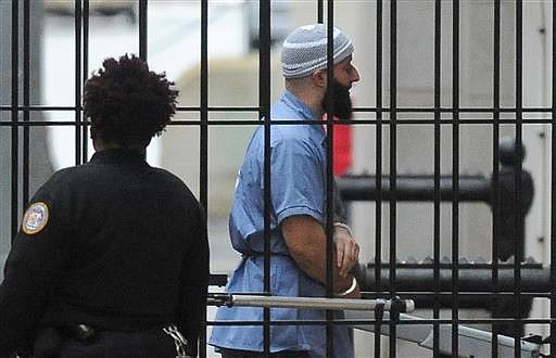 In a Wednesday, Feb. 3, 2016 file photo, Adnan Syed enters Courthouse East in Baltimore prior to a hearing. The hearing, scheduled to last three days before Baltimore Circuit Judge Martin Welch, is meant to determine whether Syed's conviction will be overturned and case retried. After spending 16 years in prison, Syed, convicted of murder, who was at the center of the podcast "Serial" has won a new trial in Baltimore. Baltimore Circuit Judge Martin Welch ruled Thursday, June 30, 2016, that Syed deserves another trial because his attorney failed to cross-examine a cell tower expert about the reliability of data. (Barbara Haddock Taylor/The Baltimore Sun via AP, File)