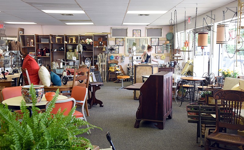 Shop Girl, located at 106 Boonville Road, Suite C, sells antiques and hosts workshops. Owner Peggy Davis opened the shop June 14.