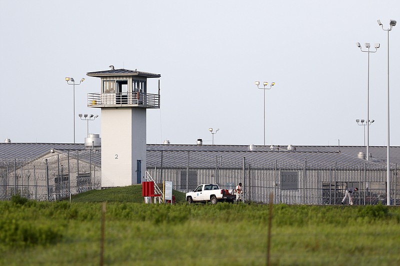 In this June 25, 2015 photo, an inmate works outdoors outside a Texas prison unit in Huntsville, Texas.  It is officially swelter season in Texas, and for most of the 150,000 inmates in the state's sprawling prison system, it means another summer of seemingly endless months in cells where temperatures can climb north of 100 degrees. How many more summers prisoners live without air conditioning will depend on how and when the courts rule in a years-long fight between prisoner advocates and Texas corrections officials. 
