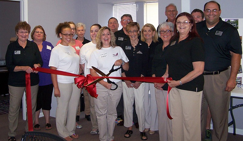 Members of Faith Maternity Care cut the ribbon on the nonprofit's new facility in Fulton, Mo.
