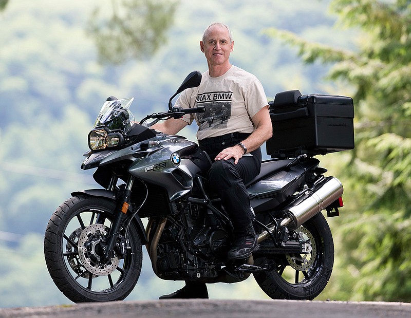 In this Thursday, June 23, 2016 photo, Dan Ruderman poses on a motorcycle at his home in Great Barrington, Mass. Ruderman plans to join a cross-country motorcycle trip to celebrate the 1916 trip made by his grandmother Adeline Van Buren and her sister Augusta Van Buren. 