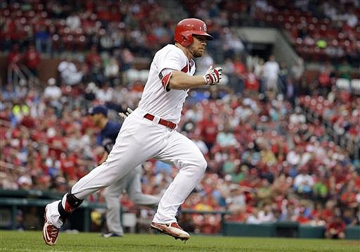 St. Louis Cardinals' Brandon Moss runs down the first base line on an RBI double during the fifth inning of a baseball game against the Milwaukee Brewers, Sunday, July 3, 2016, in St. Louis. Moss made it to third on the throw and scored scored later in the inning.