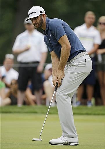 Dustin Johnson watches his missed birdie putt on the first hole during the final round of the Bridgestone Invitational golf tournament at Firestone Country Club, Sunday, July 3, 2016, in Akron, Ohio.