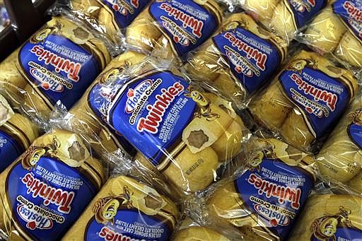 In this Nov. 16, 2012, file photo, Twinkies baked goods are displayed for sale at the Hostess Brands' bakery in Denver. 