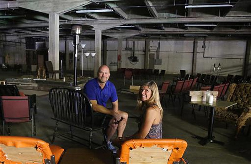 Acts Church pastors David and Kim Booker sit in a old county fallout shelter next to their sanctuary on June 23 in Waco, Texas. The congregation is seeking to raise $1.7 million to transform the 17,000-square-foot warehouse next door to the church which is downtown. The church bought the warehouse eight years ago before the downtown area began to boom with redevelopment. 
