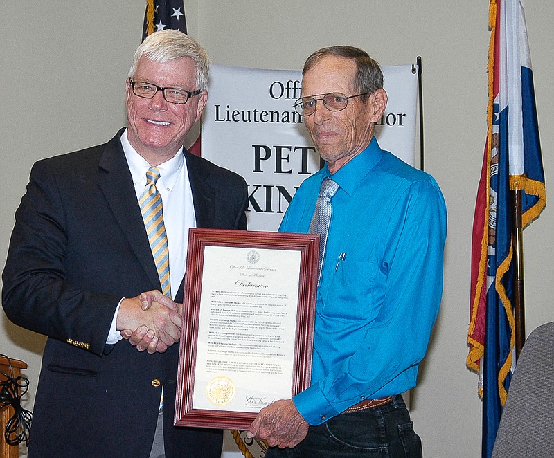Lt. Gov. Peter Kinder, left, presents a Veterans Service Award to George R. Shelley, California. An Army veteran, Shelley takes an active role in many organizations in the community.