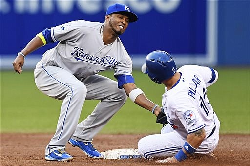 Toronto Blue Jays' Kevin Pillar tries to steal second base but is tagged out by Kansas City Royals' Alcides Escobar during the third inning of a baseball game in Toronto on Tuesday, July 5, 2016. (Frank Gunn/The Canadian Press via AP)

