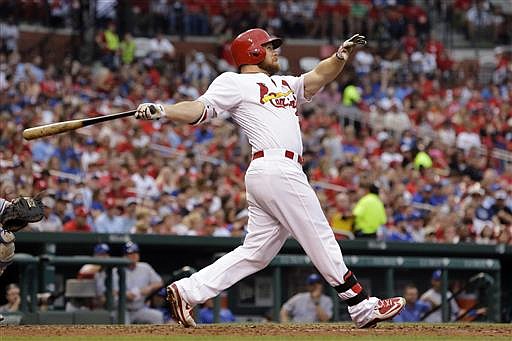 St. Louis Cardinals' Brandon Moss watches his solo home run during the fourth inning of a baseball game against the Kansas City Royals on Thursday, June 30, 2016, in St. Louis. 