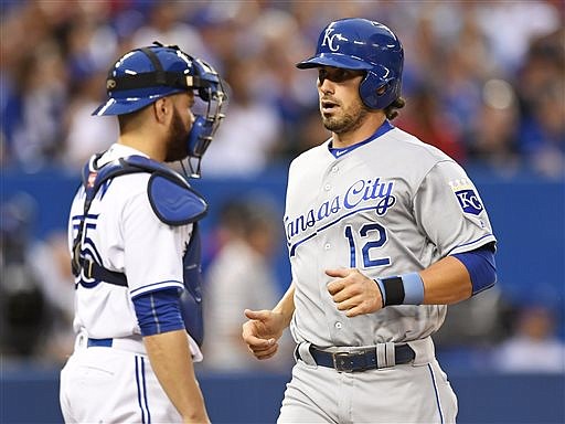 Toronto Blue Jays catcher Russell Martin looks on as Kansas City Royals' Brett Eibner scores on an Alcides Escobar triple during the sixth inning of a baseball game Wednesday, July 6, 2016, in Toronto. (Frank Gunn/The Canadian Press via AP)